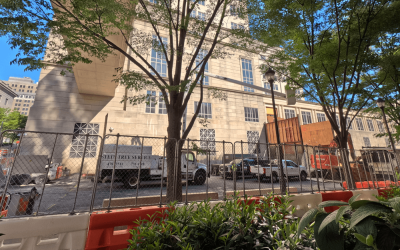 commercial fenced building with Stein truck in front - Stein Tree Service